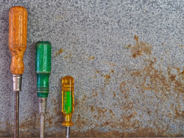 Screwdrivers on metal surface