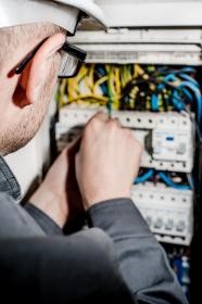 Electrician checking a distribution panel