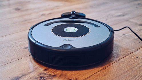 Robotic vacuum cleaner on a wooden floor